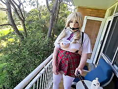 Sissy schoolgirl gagged playing on the balcony and pissing teaser