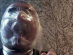 Breath play with cling film wearing latex catsuit