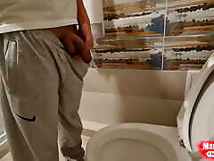 Young boy Mikel pissing at home