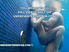 Real couples have real underwater lesbian navel play in public pools filmed with a underwater camera