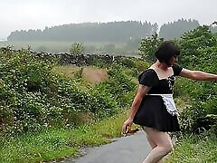 Crossdressing slut Maid on a fatema baby lane in the rain