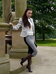 Gorgeous dark-haired Sophia gets out the office to walk and taunt outdoors in nylon stocking and high stiletto heels