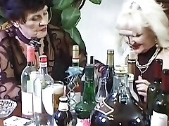 Two mischievous ladies from Germany pleasing each other after a game of cards