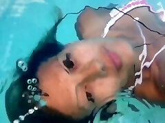 Face-up breathhold underwater ballerina dancer feet 