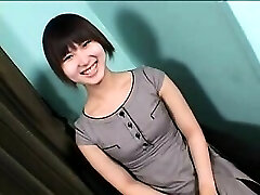 Enticing Asian shemale with a adorable smile sensually drops he