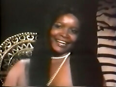 Fleshy and pretty vintage black girl with enormous breasts