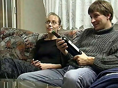 Young Couple in the 90s smashed on the Couch