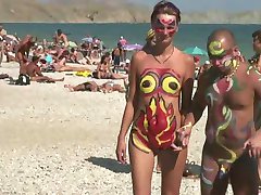 Girls with painted bodies in Russian nudist beach