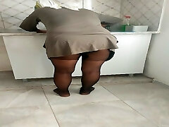 Turkish mature hijab woman village building cleaning the kitchen 