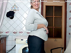 Lukerya tries on a jacket to a mini-skirt, shows bare boobs