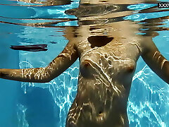 Small tits blonde stunner Sofie Otis swimming naked