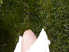 Jerking off in the meadow.