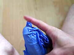 Pampered my cock with a latex glove.