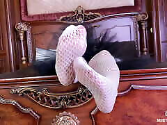 The Goddess in white fishnet tights foot teasing on the bed The Goddess in white fishnet tights foot teasing on the bed