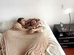 Lesbian sex under the covers on a cold morning