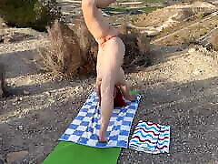 Outdoor Naked Yoga Session. Stretching Glutes and Split.