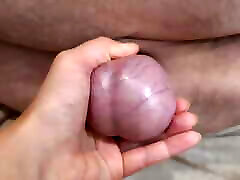 Scrotum and balls are pulled and tortured