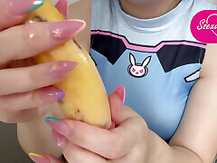 My stepsister puts a condom on the banana, plays with it, then sticks it in a fake pussy