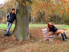 Hot red colored girl stays and enjoys outdoor masturbation