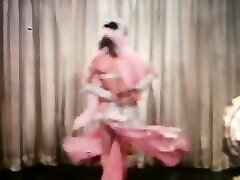 Vintage brunette stripper dancing