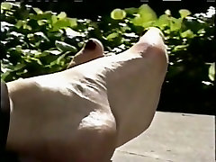 Feet relaxing outdoors