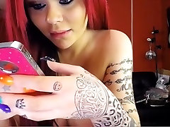 Long-haired skank takes off her bra to reveal a pair of hug