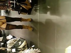 Exhibitionist woman lifts dress in store