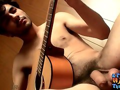 Straight musician has a guitar tricked to tree before masturbating
