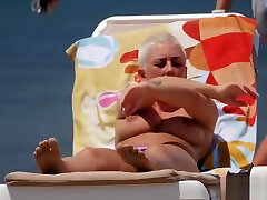 Emo chick with big tits and pierced nipples sunbathing on raep boay sex beach
