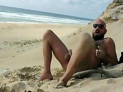 Bearded stud fucks himself on beach Bearded stud fucks himself on beach