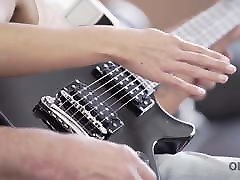 OLD4K. Young lassie makes some noise with old bass-guitar