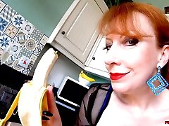 Busty mature Red XXX fucks her big black dildo