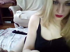 woman in stockings fingering pussy on the bed
