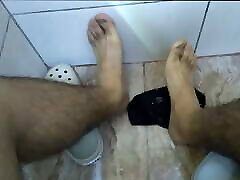 Blue socks and dirty feet after work