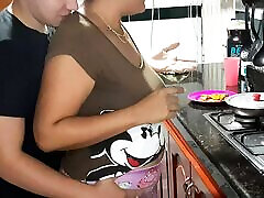 My stepmother gives me a rich blowjob in the kitchen.